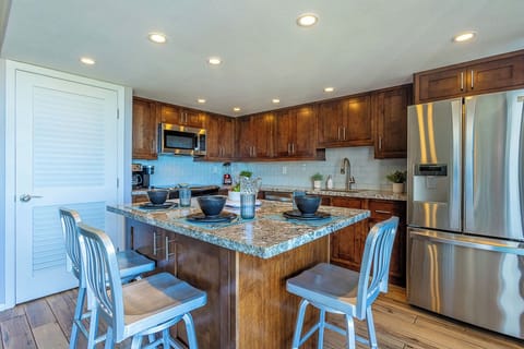 Seating for 3 at the spacious island