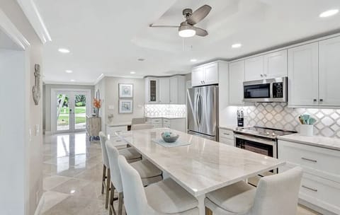 Gleaming countertops and island seating for casual meals