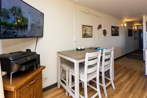 Enjoy the dining table for four, smart TV, and wifi printer. - Enjoy the dining table for four, smart TV, and wifi printer, while surrounded by island inspired art.