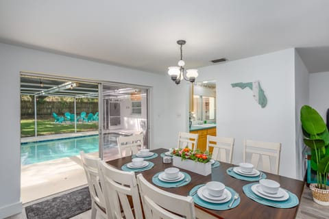 The dining room also has direct views of the swimming pool and back yard. 