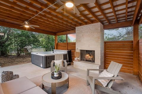 Beautiful outdoor fireplace + hot tub.