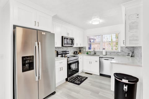 Open Kitchen w/stainless steel appliances,island,access to Garage -MainLevel