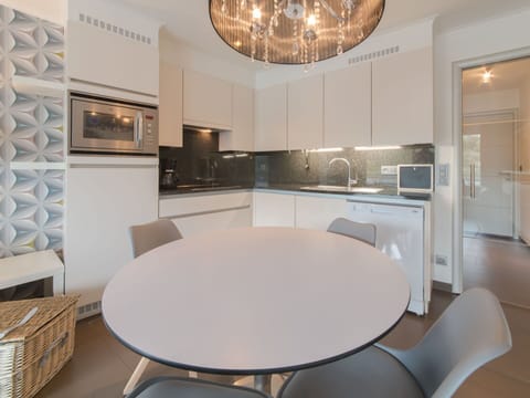 Table, Furniture, Property, Cabinetry, Chair, Countertop, Wood, Interior Design, Lighting, Architecture