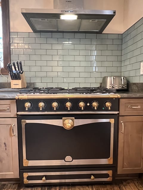 Our kitchen includes a La Cornue oven for homecooked family meals.
