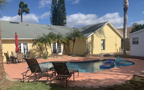 Soak in the sun poolside with your favorite ice cold drink next to you.