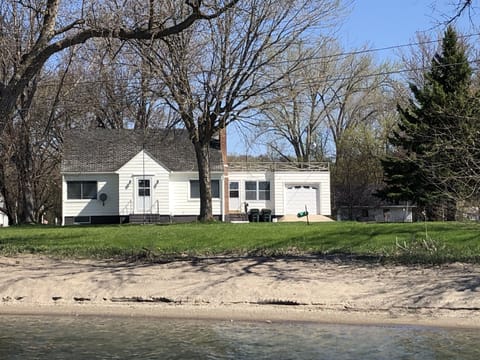 View from the lake including 100 ft sandy beach and private dock