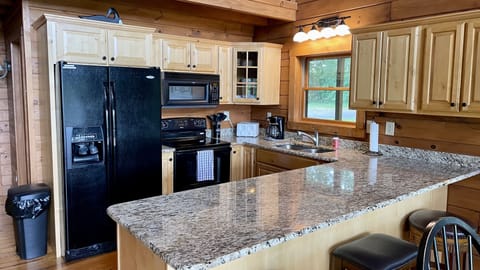 The kitchen is stocked with all the utensils and appliances you need!