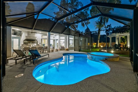 Screened-in heated pool & spa - enjoy year round relaxation