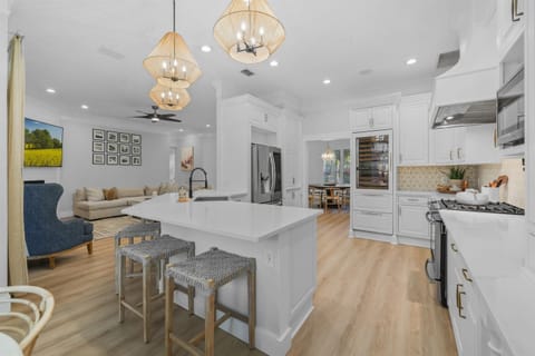 Gather around the oversized island — perfect for cooking, coffee, and conversation