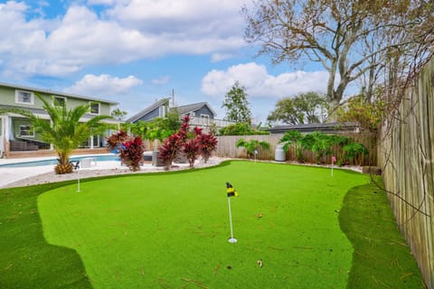 Private backyard oasis with putting green