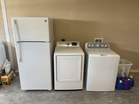 Full size refrigerator plus washer / dryer in the garage.
