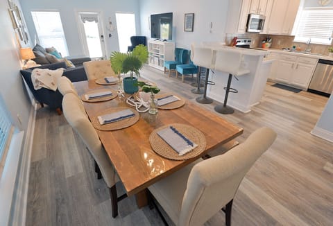 Dining tabe fits 8 comfortably and extra seating at the bar. 