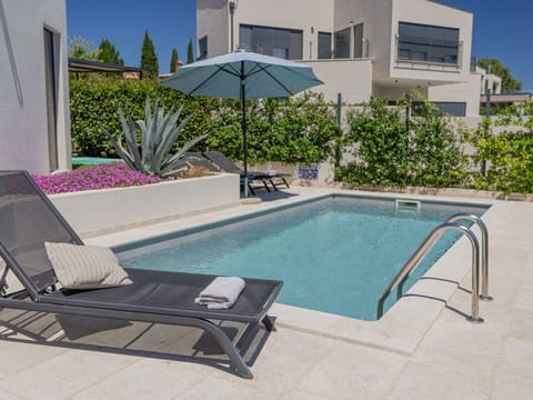 Plant, Water, Building, Property, Swimming Pool, Sky, Azure, Shade, Outdoor Furniture, Tree