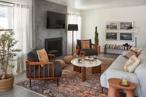 Gather around the fireplace in this relaxed living space