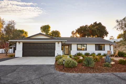 Front of Home with 2-car garage and driveway space. Sustainable