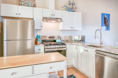 Beautiful stainless steel appliances with gas range.