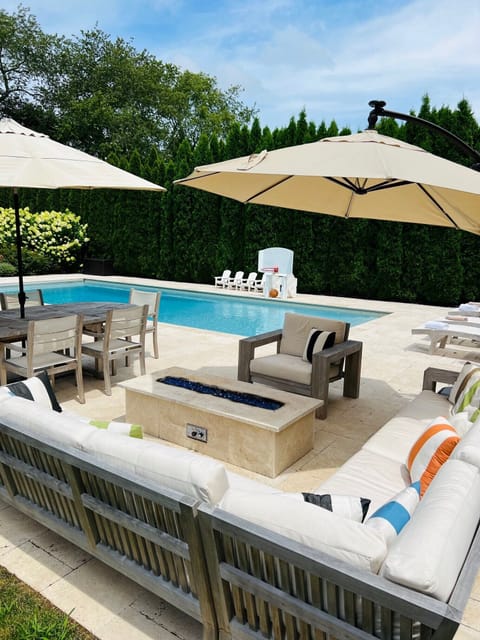 Gas Fire Pit Table by dining and pool.