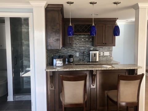 The basement entertainment area bar