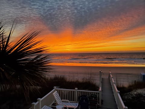 Watch an amazing sunrise over the ocean each morning from a luxury beach house 