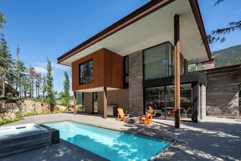 - Stunning modern exterior with pool and mountain backdrop  
- Outdoor seating for gathering after a refreshing swim  
- Designed for year-round comfort and scenic relaxation  
