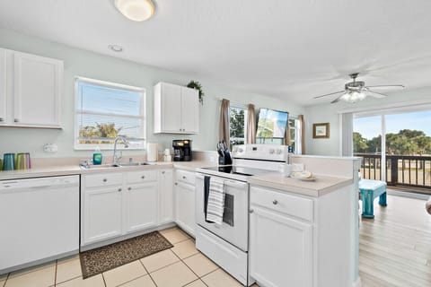 UNIT A  Fully equipped kitchen with flat stove top, refrigerator and freezer, dishwasher, coffee maker and more. (food and coffee not provided)