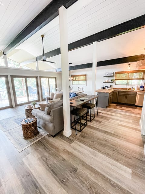 Living room, dinning area and kitchen with vaulted ceilings & lake views
