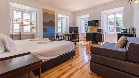 Gorgeous main area with a king size bed, a balcony and an AC unit #AC #spacious