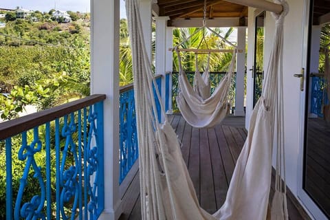 Private balcony with seating and hammocks