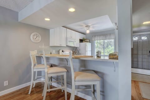 The Kitchen Has a Bar and Stools