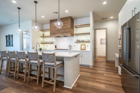 Luxury kitchen with ample counter space and high end stainless steel appliances