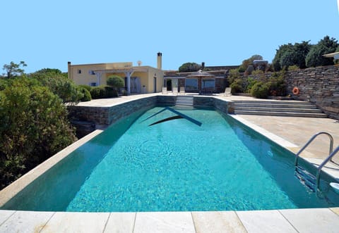 Large swimming pool with the villa in the background