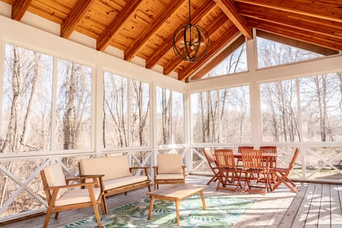 The fully screened-in porch is the most popular room in the house.
