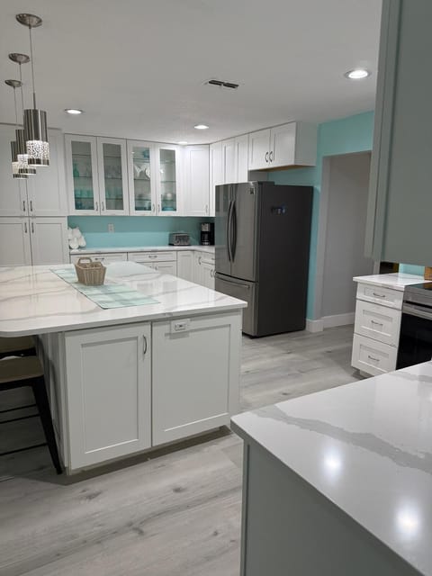 Side cabinets have large stock pots and air fryer