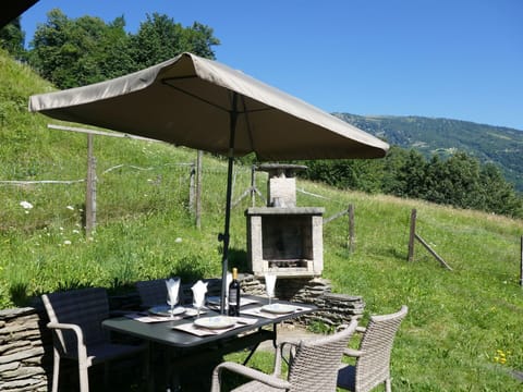 Table, Furniture, Plant, Property, Sky, Chair, Umbrella, Outdoor Table, Tree, Outdoor Furniture