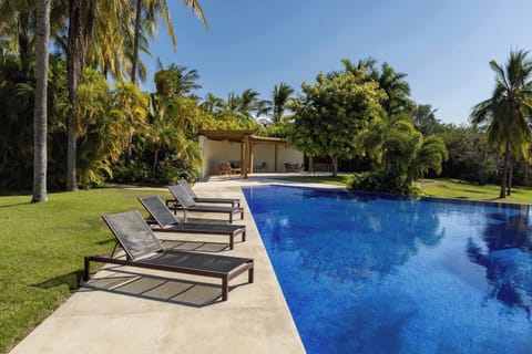 Refreshing pool surrounded by tropical gardens