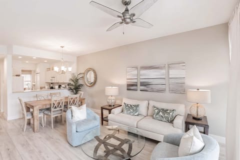 Living room with comfy sofas, TV and Ceiling Fan