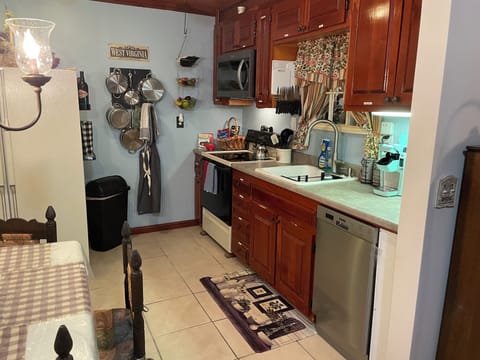 Kitchen fully stocked. Full sized appliances, pots and pans and cooking utensils