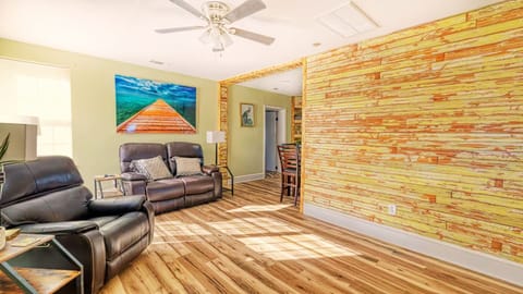 As you enter, a 120-year-old bead board wall greets you, with a recliner set