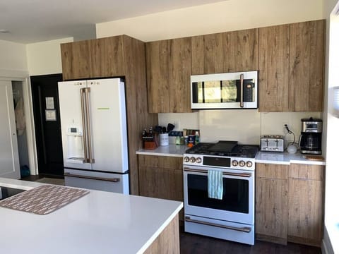 Kitchen with GE Café series appliances.