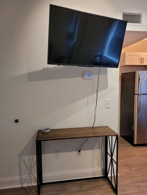 Small work desk. 43" HDTV smart TV for streaming.