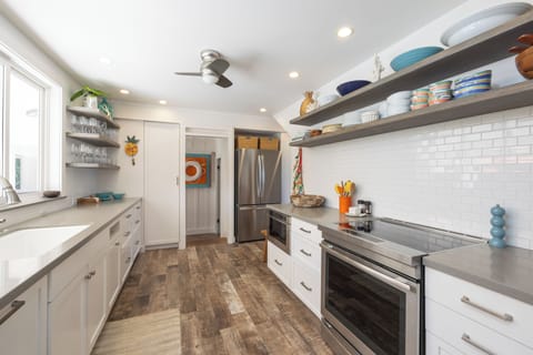 Kitchen is full stocked.  Home includes a large capacity washer and dryer.