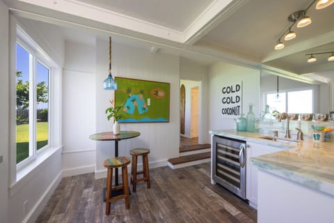 Beverage nook has a wine chiller and beverage refrigerator, coffee maker.