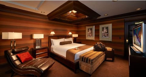 Sink into warm lighting and lounge beside your king bed.
