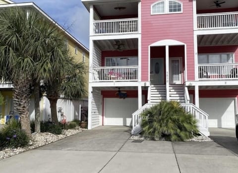 The Feel Good Flamingo is located on the left with the light blue door 