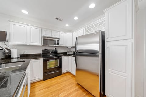 View of the kitchen appliances plus a Keurig machine that is just out of view