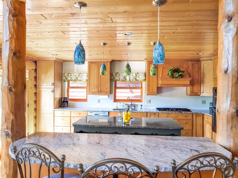 Three barstools at this kitchen island offer additional dining space