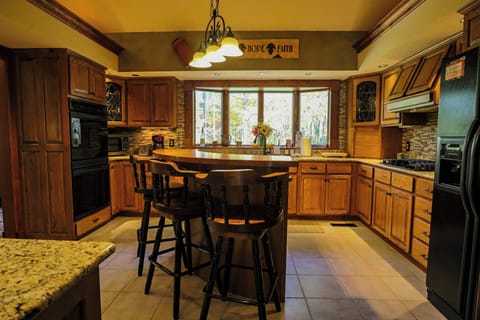Full kitchen with modern appliances and fully stocked