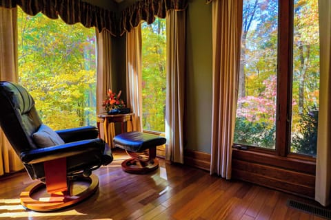 The birding area with binoculars and a view of a couple feeders.