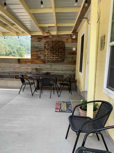 Table and chairs on back patio.