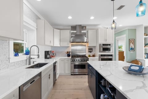 Your gourmet kitchen awaits with marble countertops, professional appliances, and everything needed to create memorable meals during your stay.